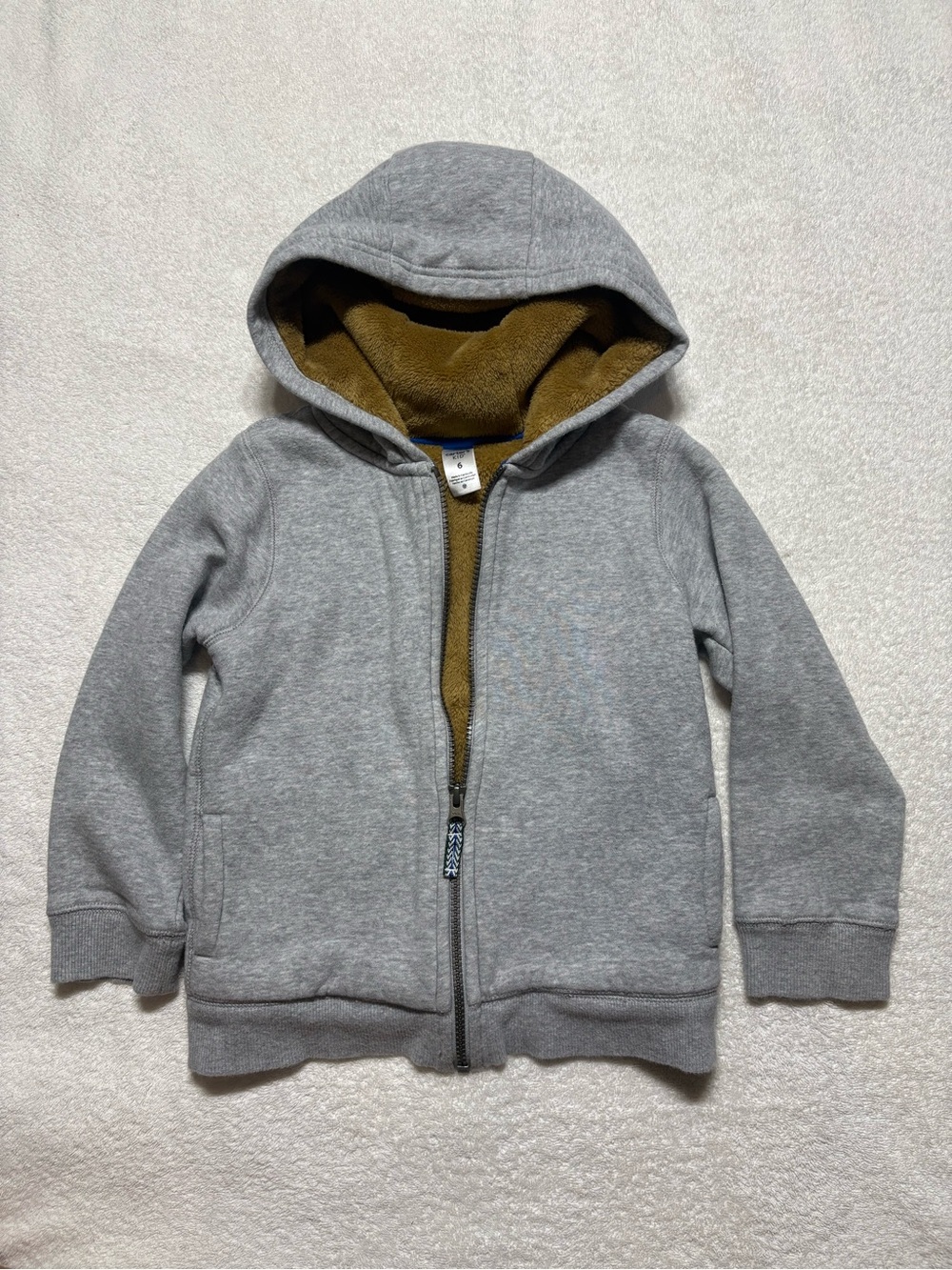 Carter’s Kid Fuzzy-Lined Hoodie. Color. Gray with tan fuzzy lining.